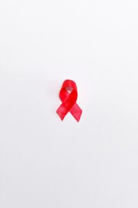 picture showing HIV red ribbon. Stopping the spread of HIV in older adults. azelders.com